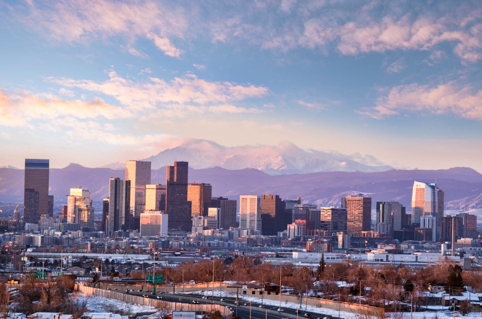Denver skyline at dusk with the Front Range behind